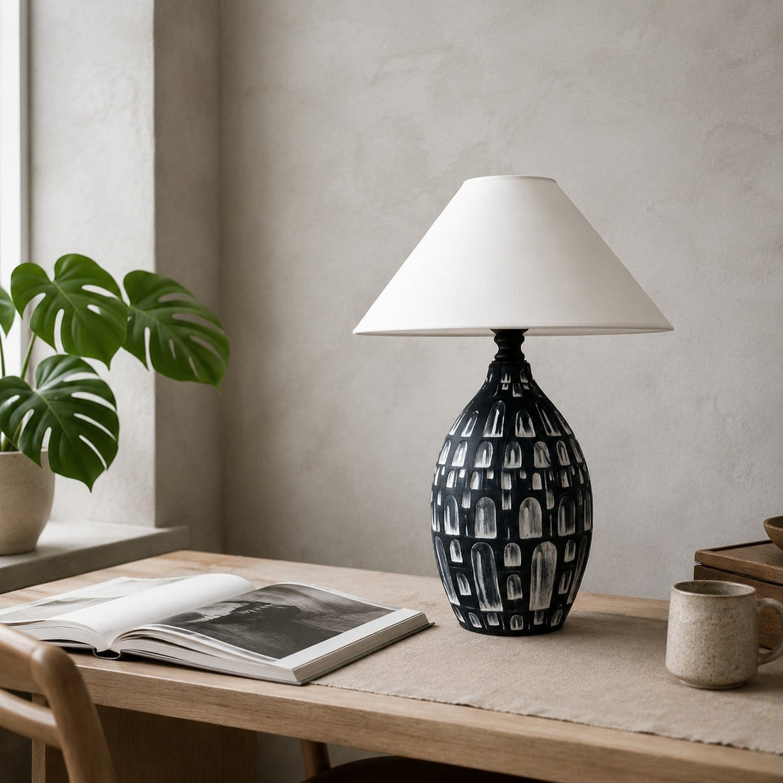 Black ceramic table lamp on a desk or console