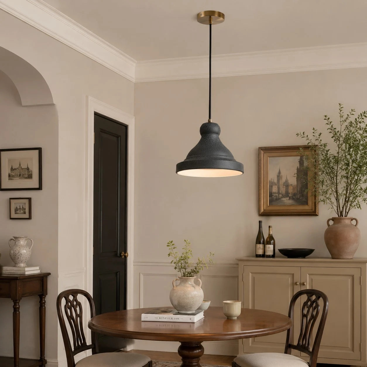 Gray metal pendant lamp in a round dining room scene