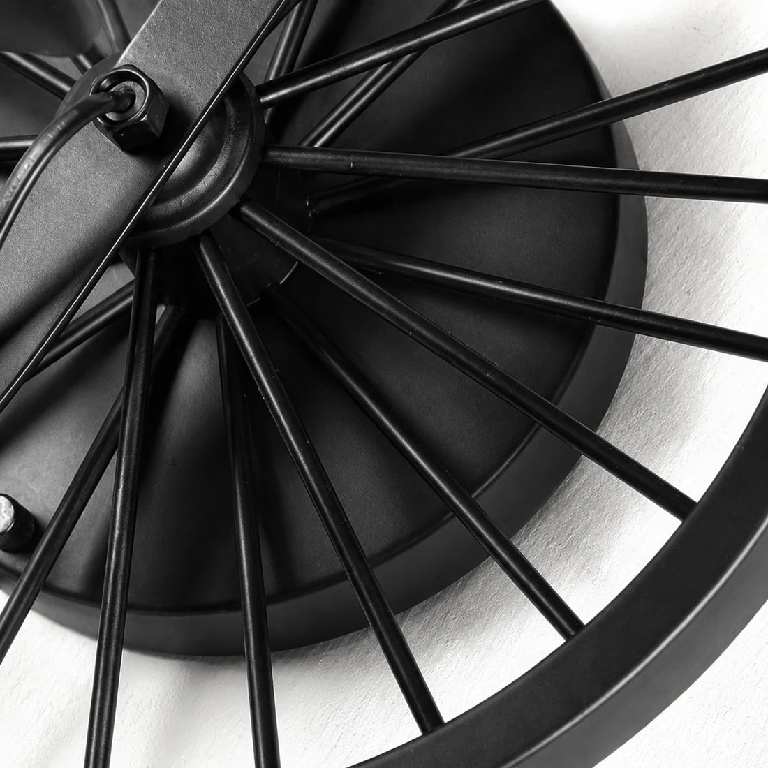 Close view of the black wagon wheel backplate and spoke detail