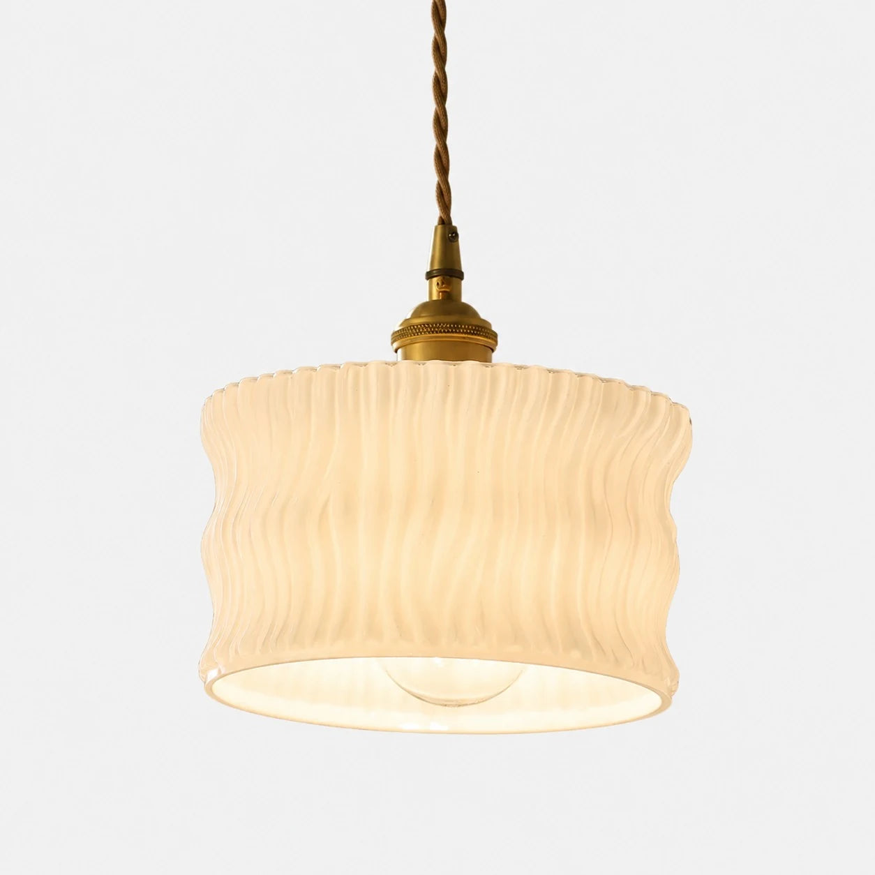 Frosted white ripple glass ceiling pendant with warm bulb