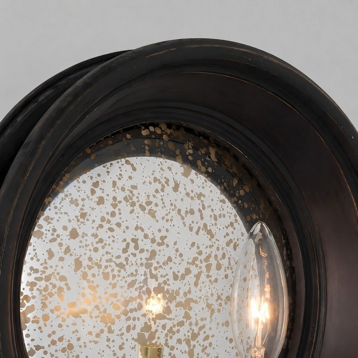 Vintage black round mirror wall sconce with brass candle arm