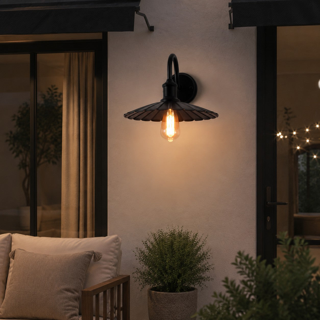 Outdoor wall sconce beside a patio seating area