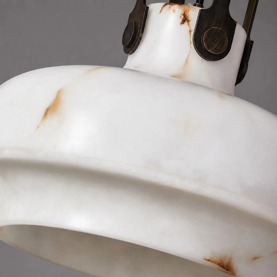 Close view of the softly lit faux alabaster shade