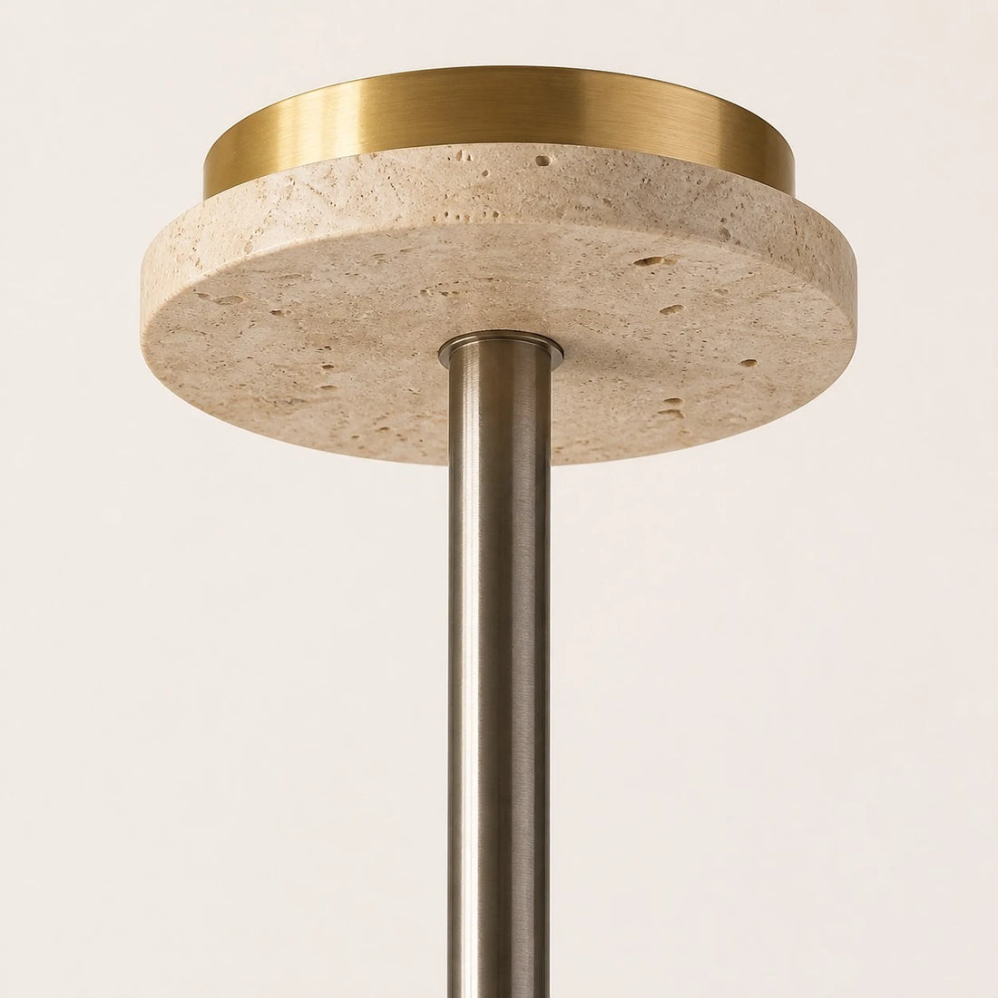 Close view of the travertine ceiling canopy and metal suspension rod
