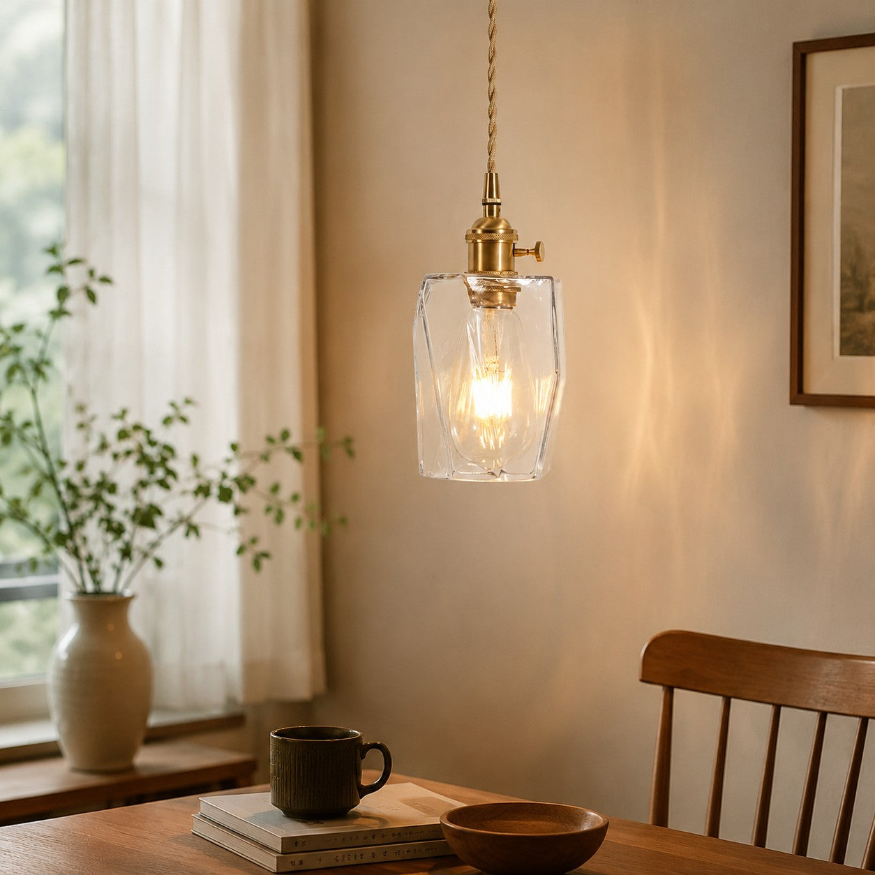 Style X open-frame clear glass pendant in a warm interior corner