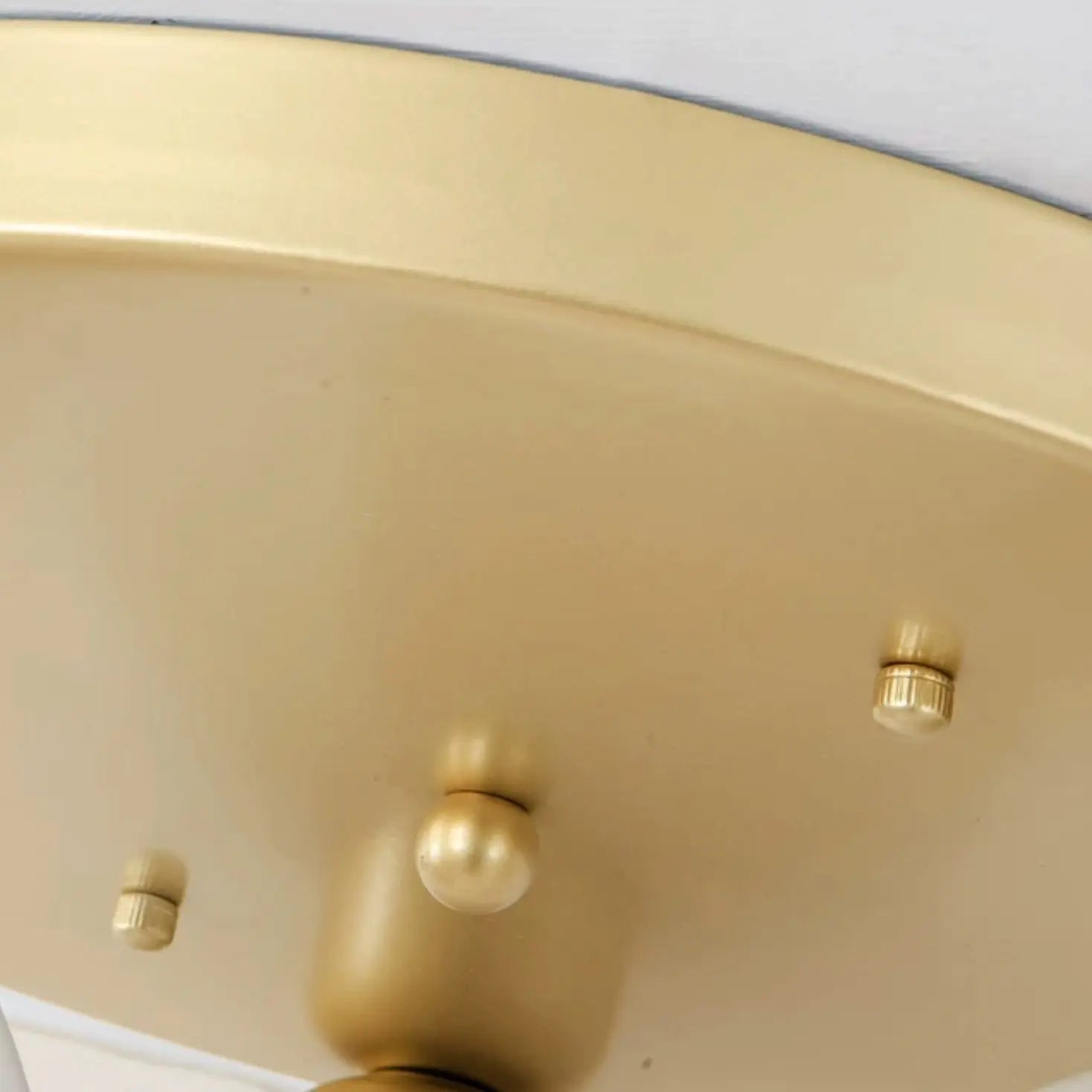 Gold ceiling canopy and mounting hardware detail
