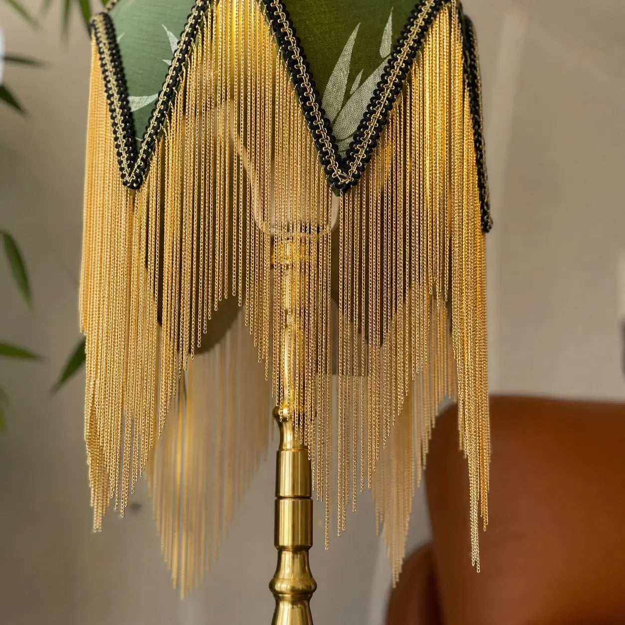 Gold tone tassel and shade trim detail