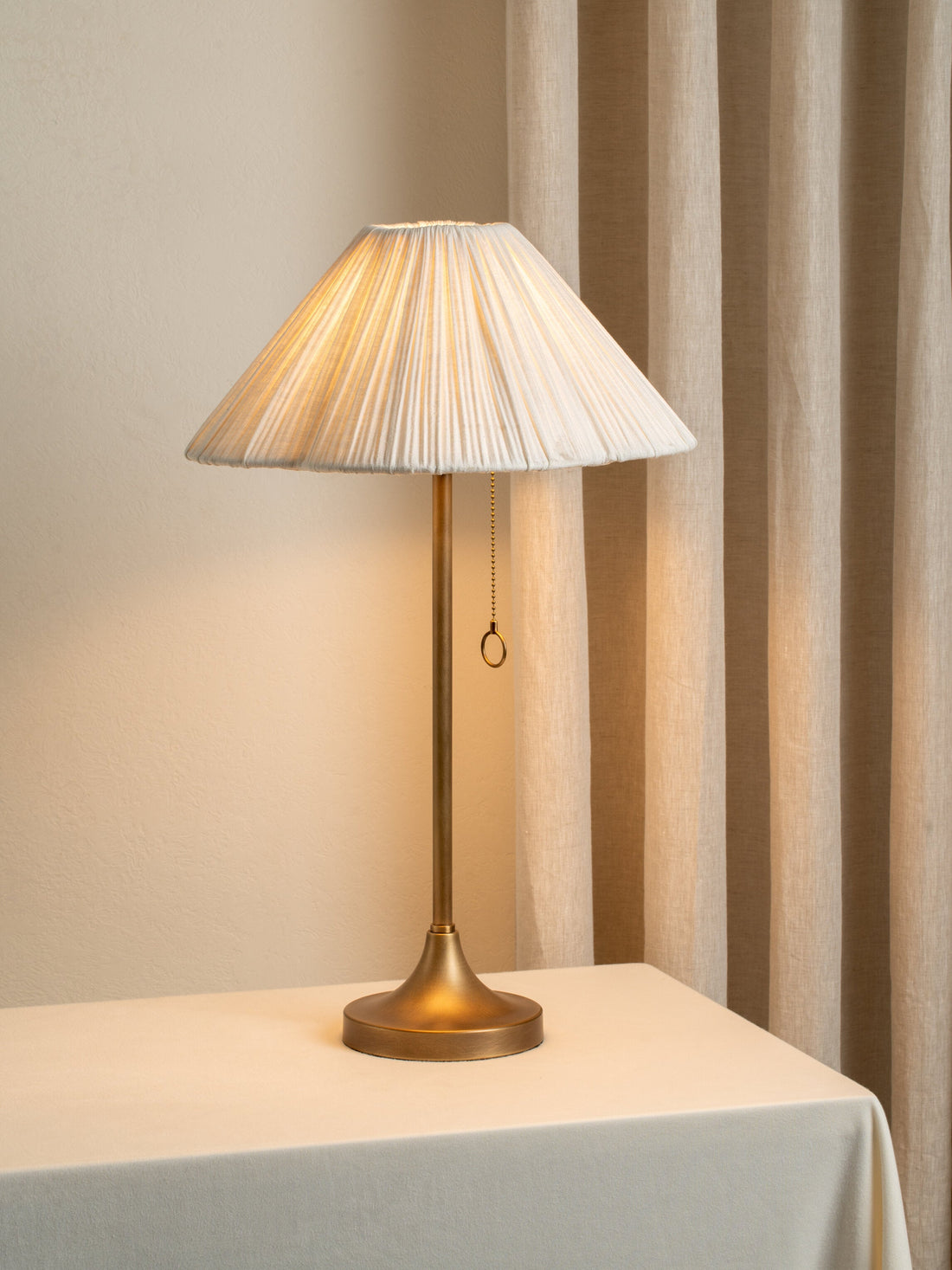 Lindi - aged brass and scalloped linen table lamp