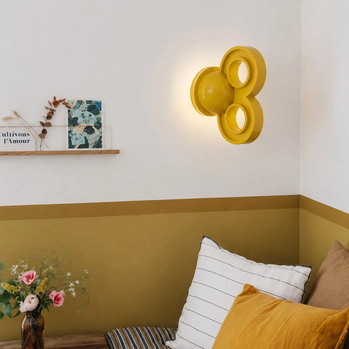 Yellow wall light in a soft sofa and bedside corner