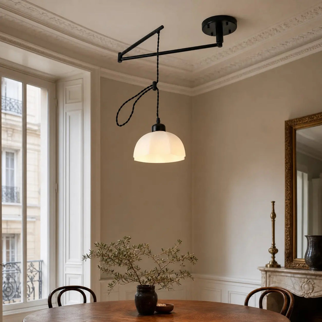 Black pendant installed in a dining space