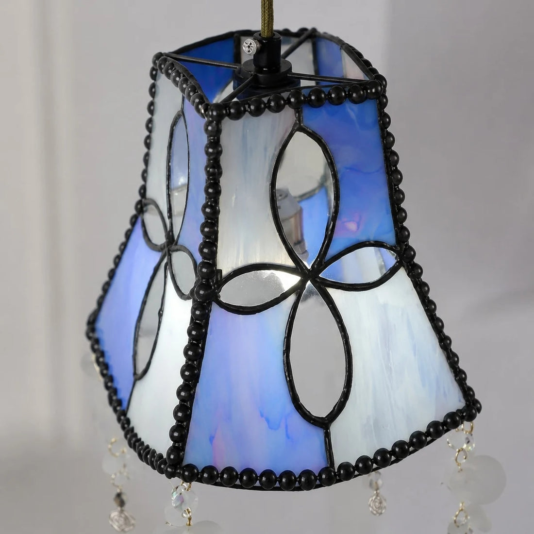 Lit shade detail with blue white shell panels
