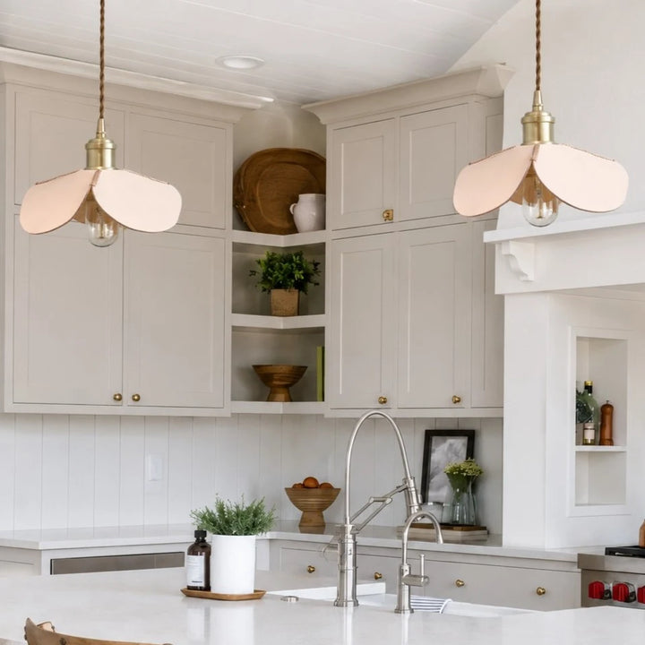 Leather petal pendant lights over a bright kitchen island