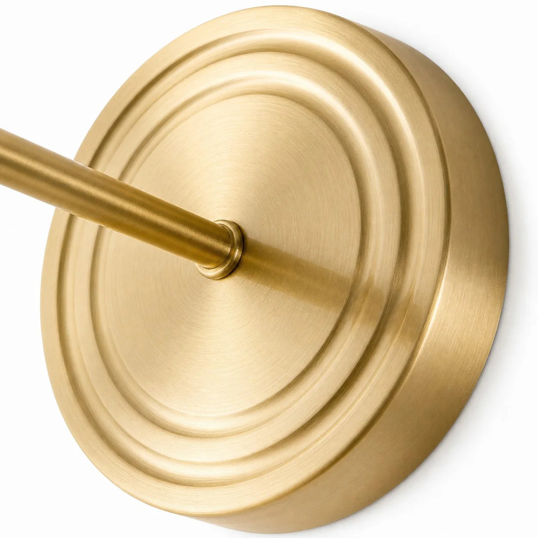 Close view of the brushed brass-toned wall plate