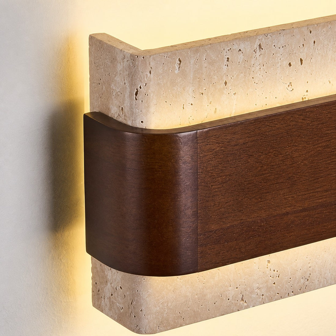 Rounded wood side and glowing travertine edge detail