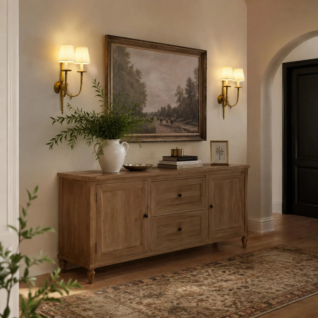 Double wall sconces mounted above a wooden console