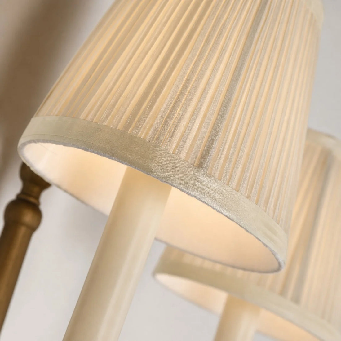 Close view of cream pleated fabric lamp shade