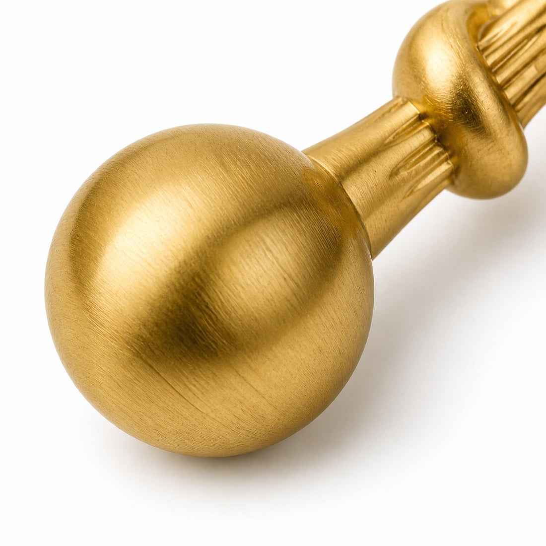 Close view of the brushed brass cabinet pull end
