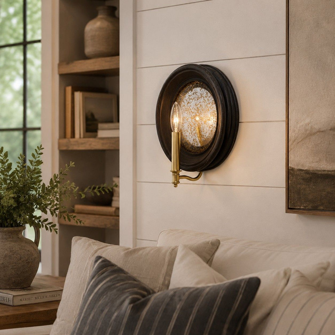 Vintage black round mirror wall sconce with brass candle arm