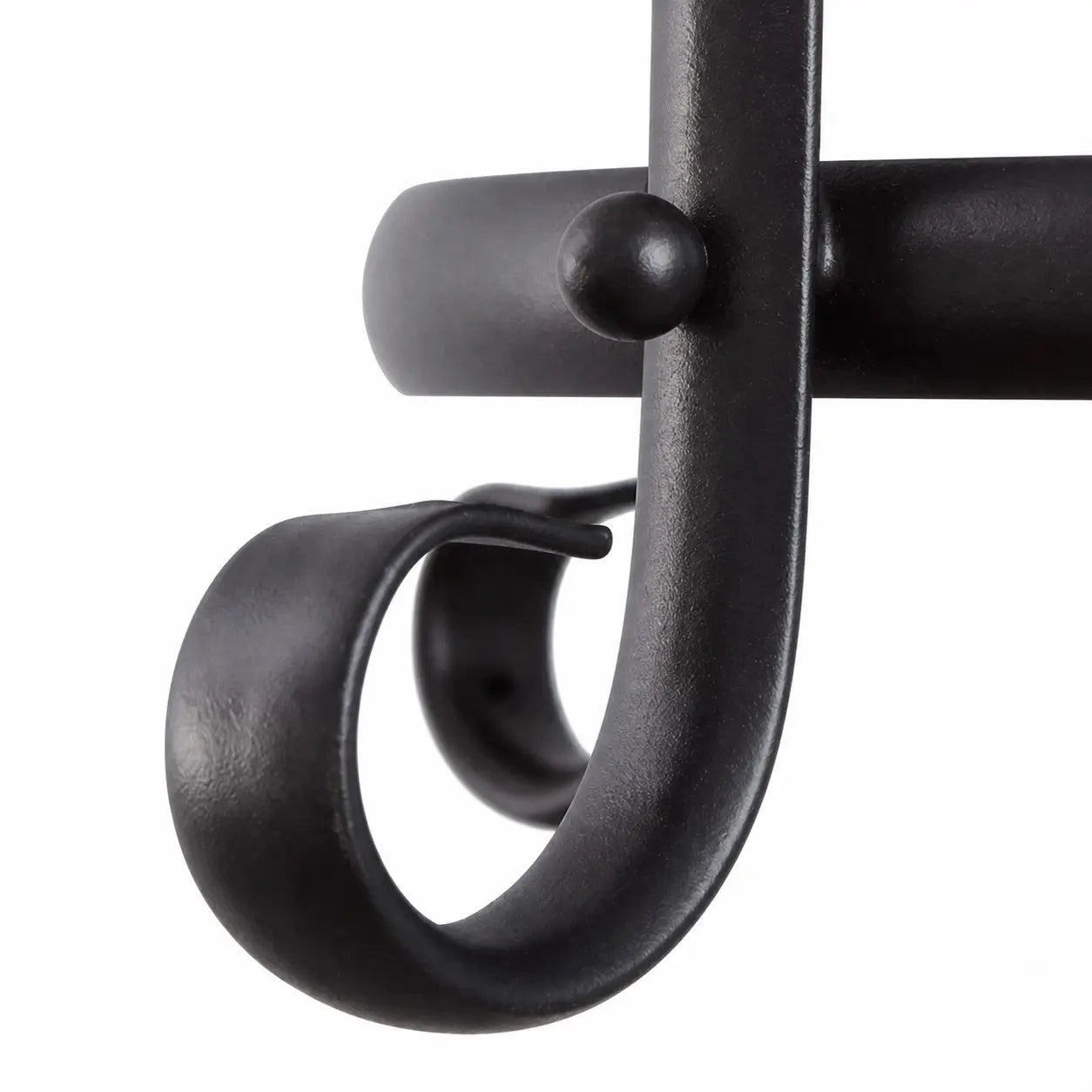 Curved black iron scrollwork detail