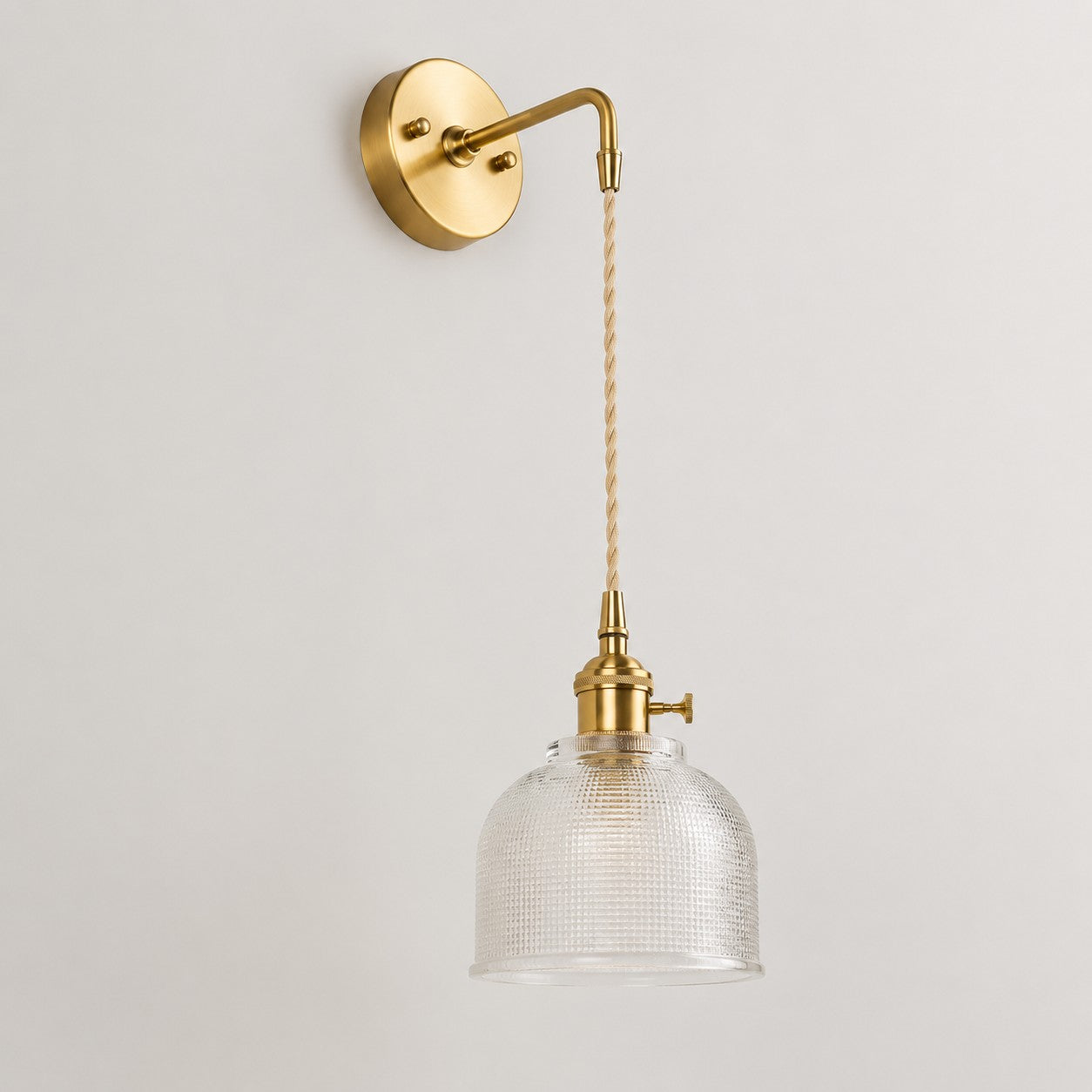 Clear glass wall light with brass arm, CW shade 11 cm high and 14 cm diameter