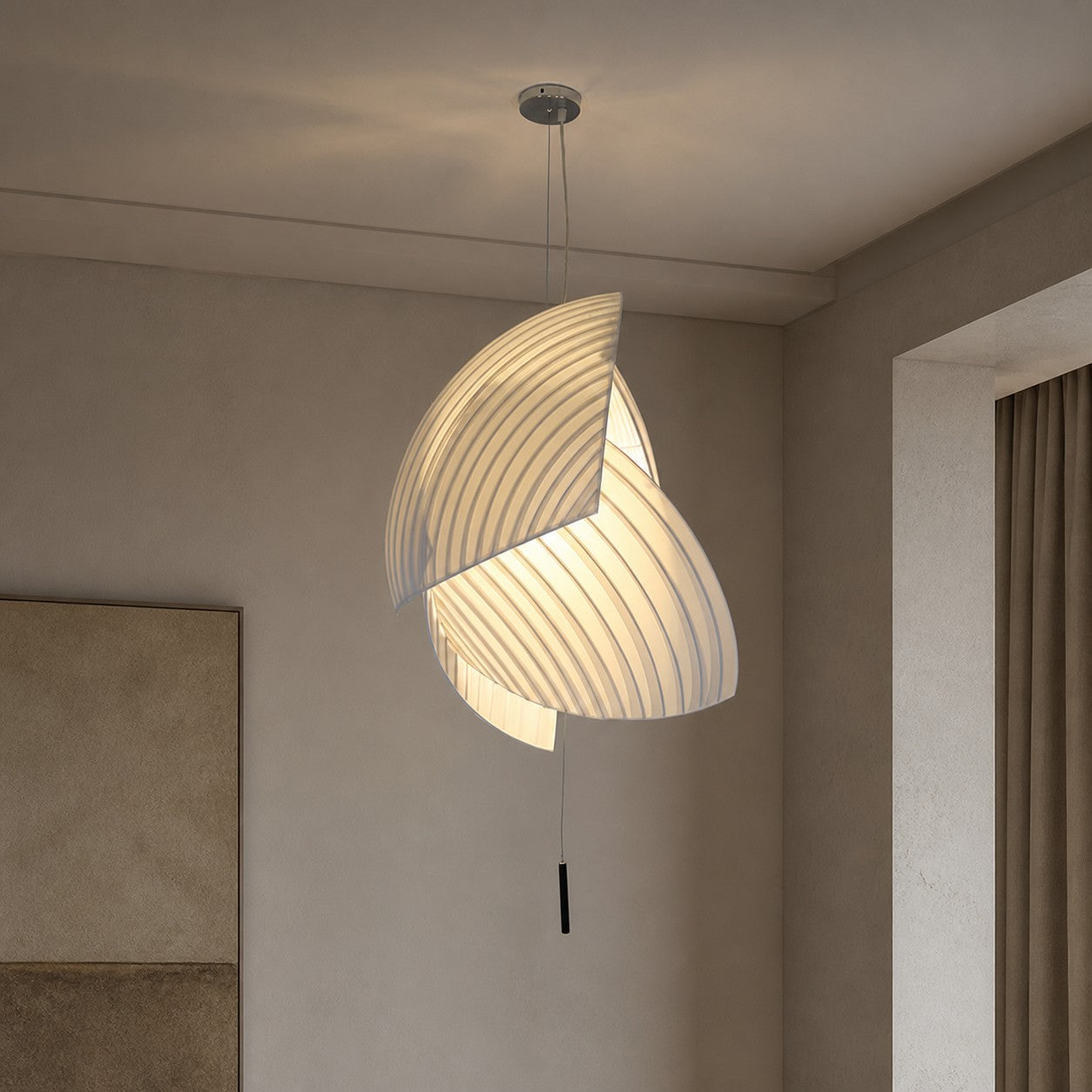 Pleated fabric pendant light installed in a room