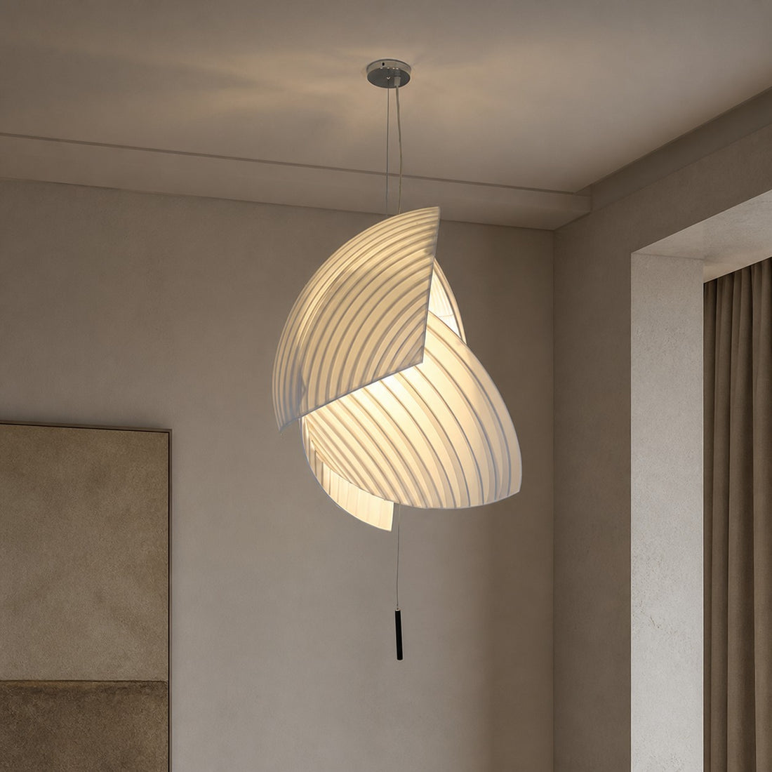 Pleated fabric pendant light installed in a room