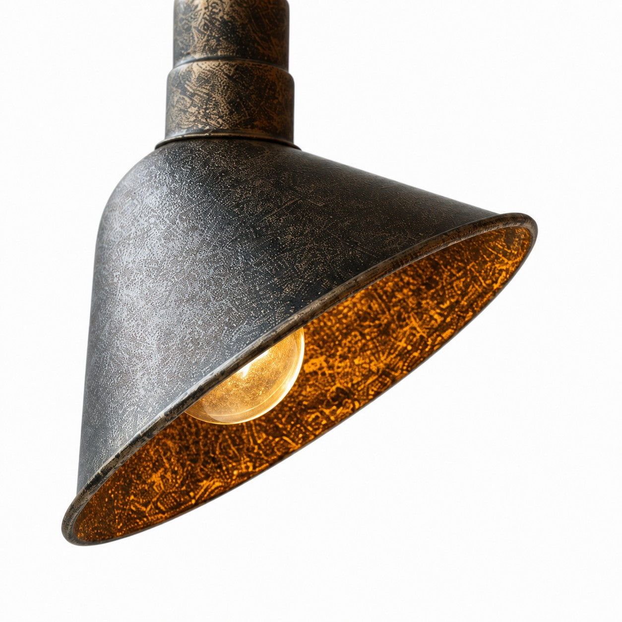 Close view of antique brass cone shade texture
