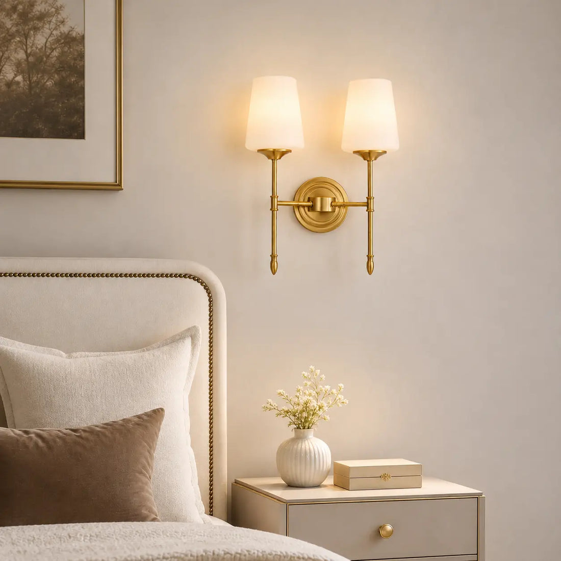 Vintage brass wall light creating a warm bedroom atmosphere