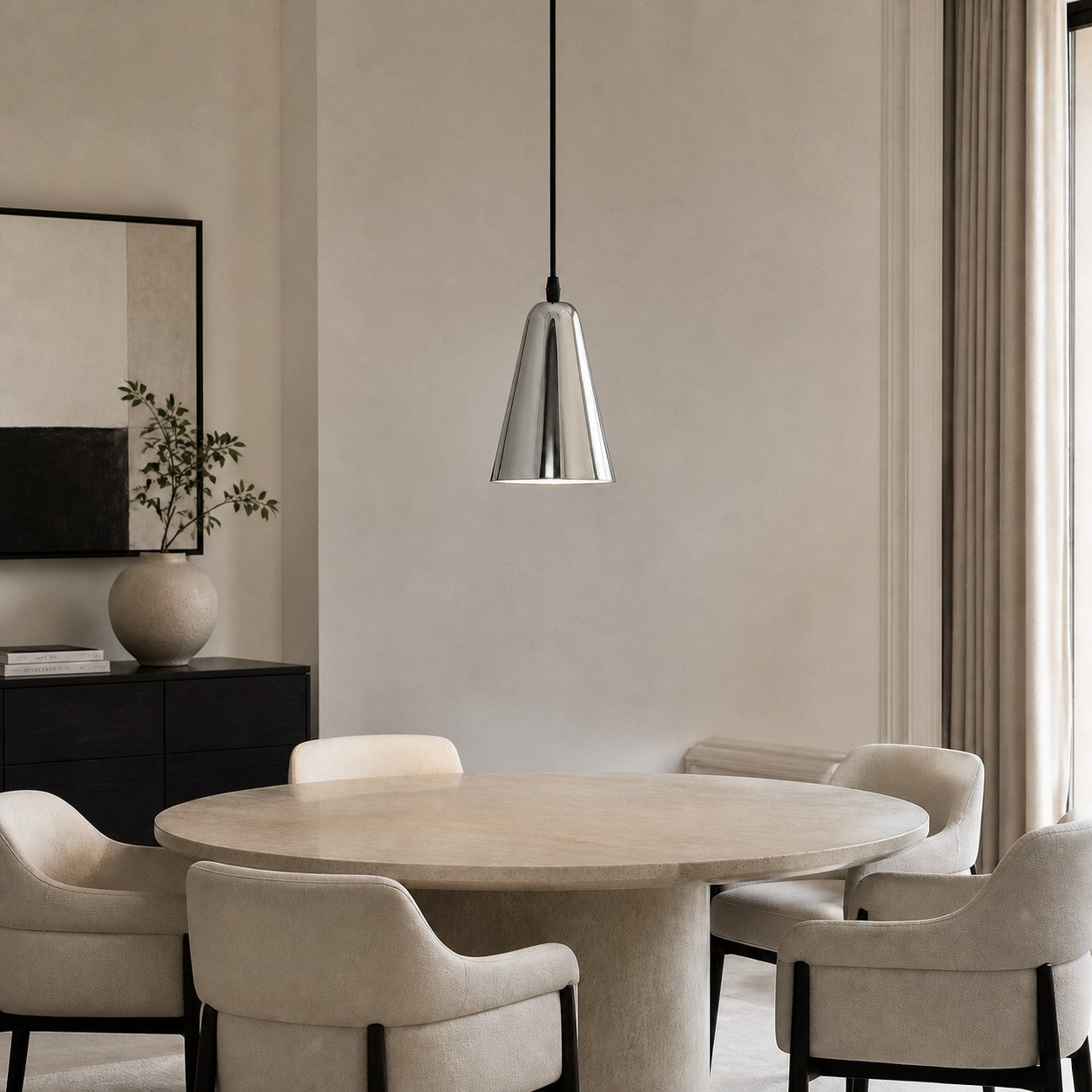 Tapered chrome pendant light above a contemporary dining table