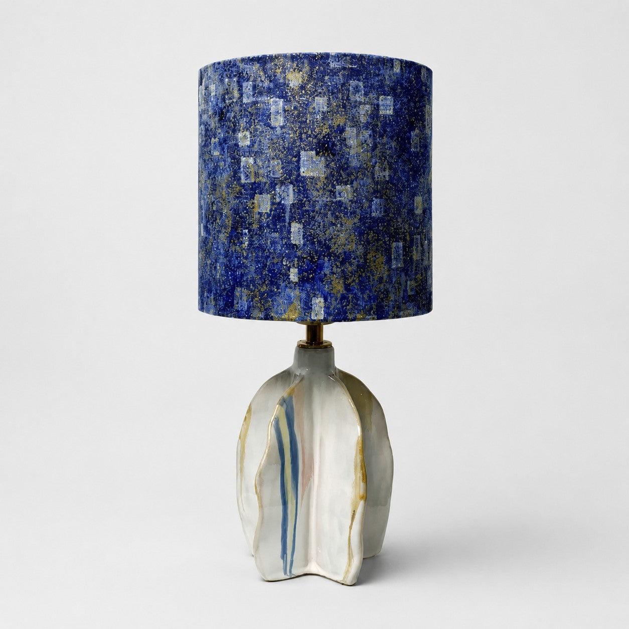 Handmade ceramic table lamp with blue abstract fabric shade