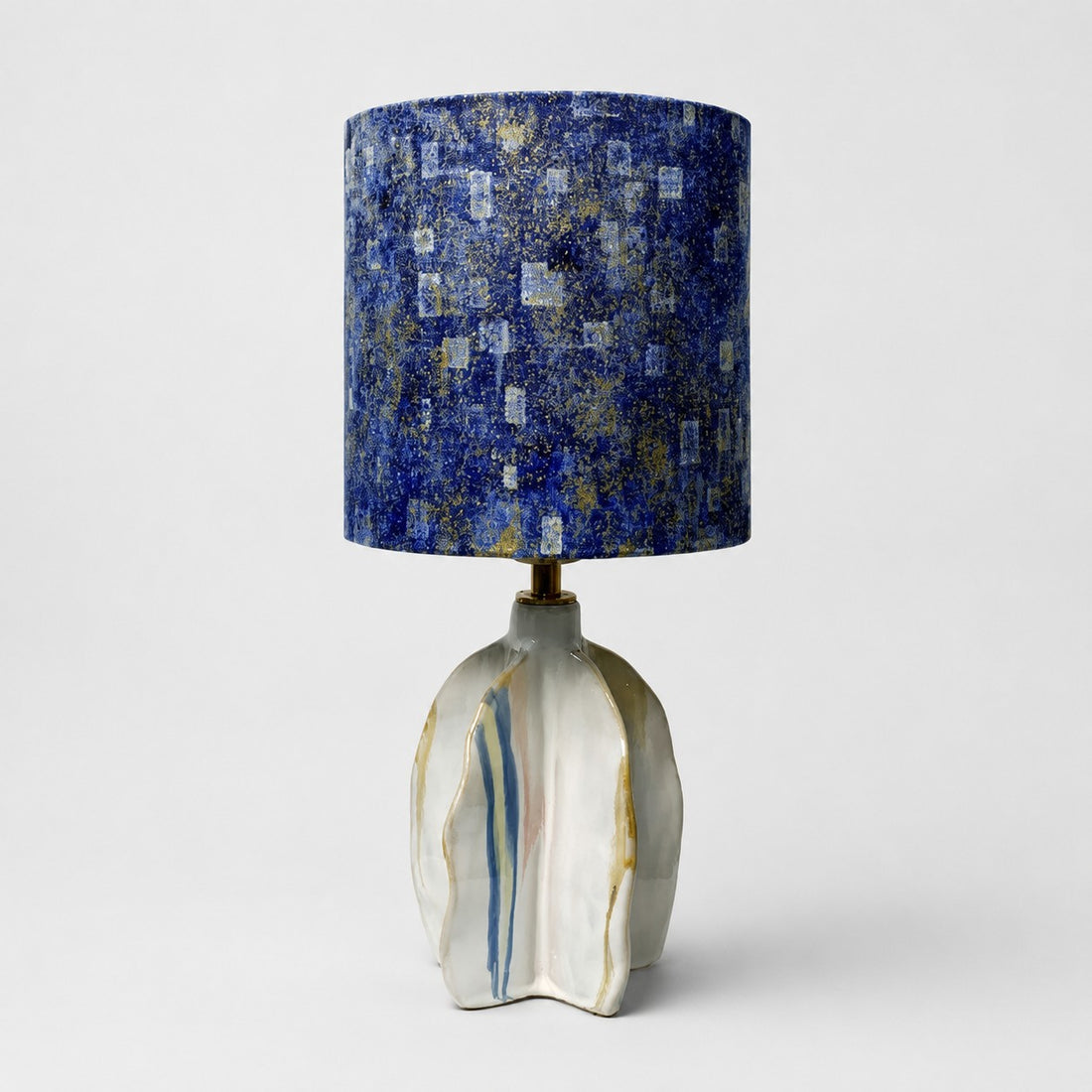 Handmade ceramic table lamp with blue abstract fabric shade