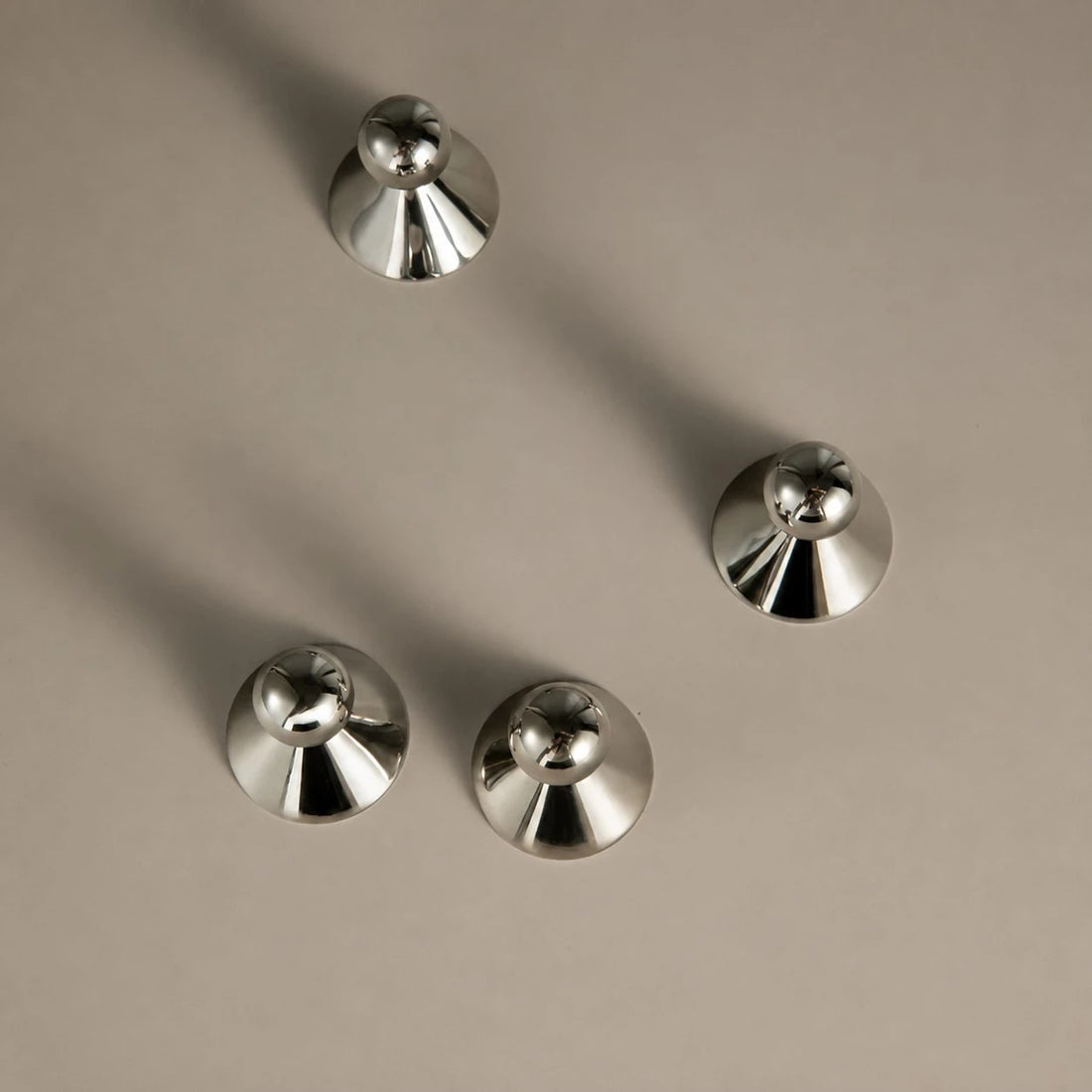 Top view of round cabinet knob bases and spherical grips