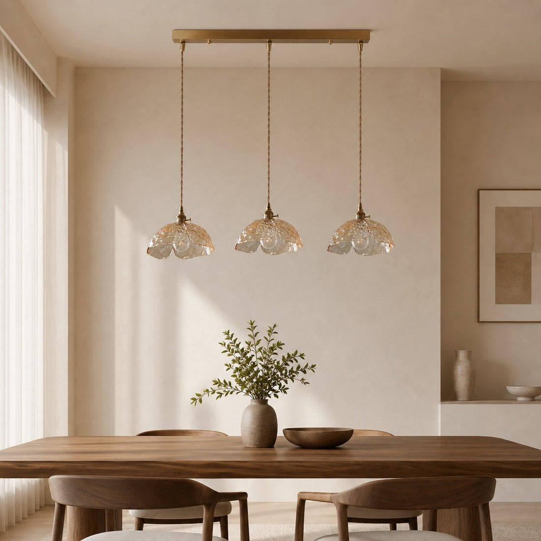 Three clear flower pendants over a wood dining table