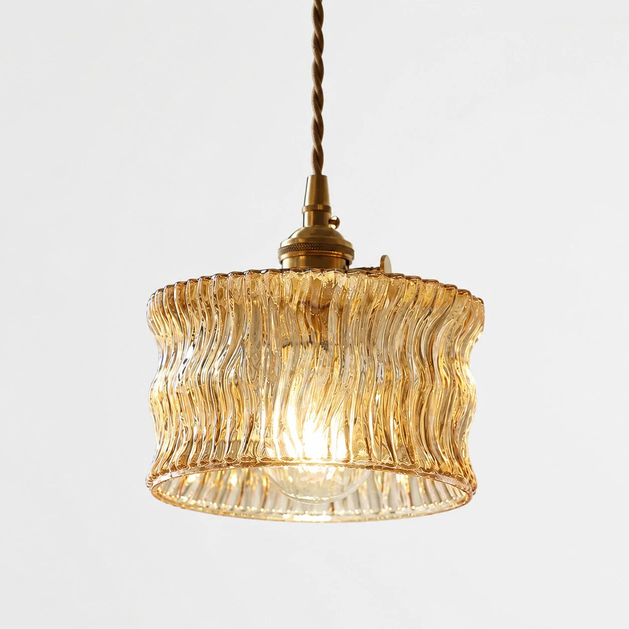 Amber tea ripple glass ceiling pendant with warm bulb