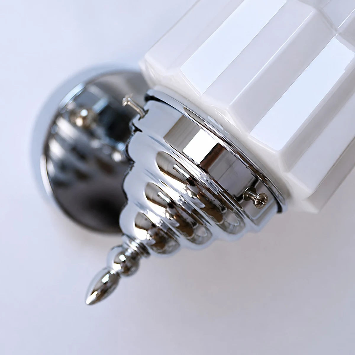 Chrome shade holder and wall arm detail