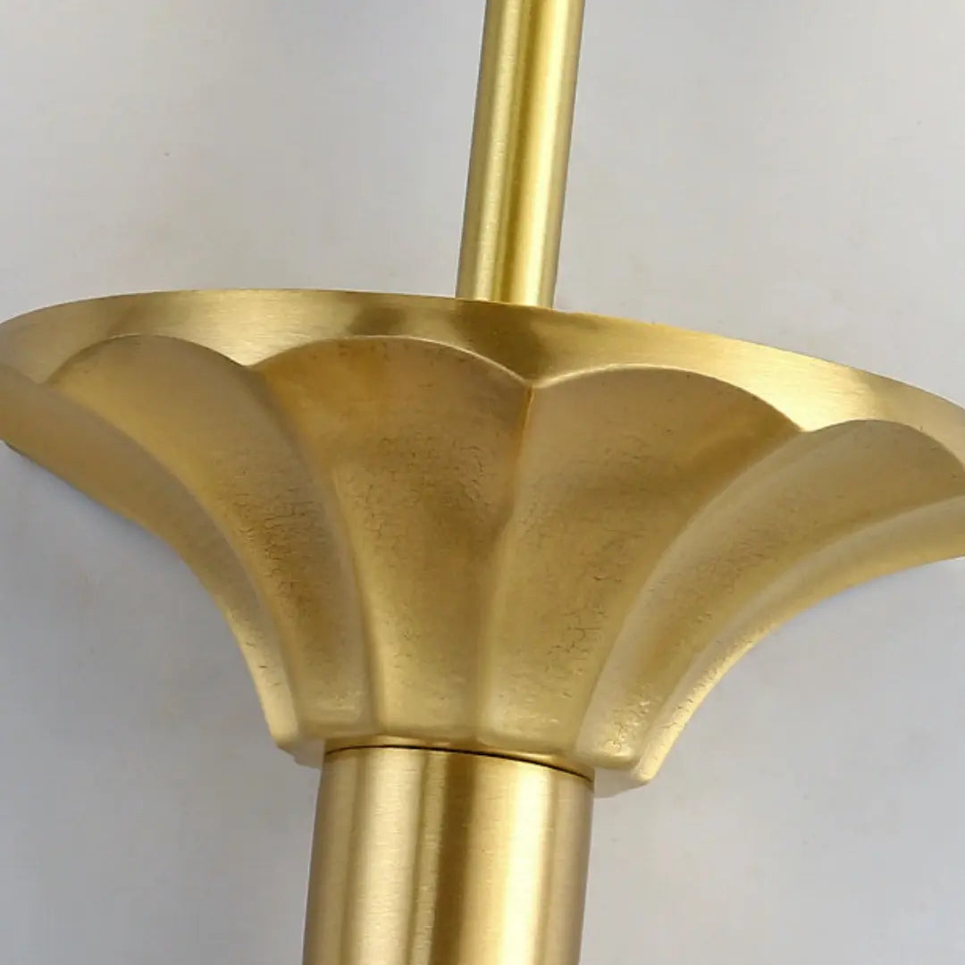 Floral-inspired brass cup detail