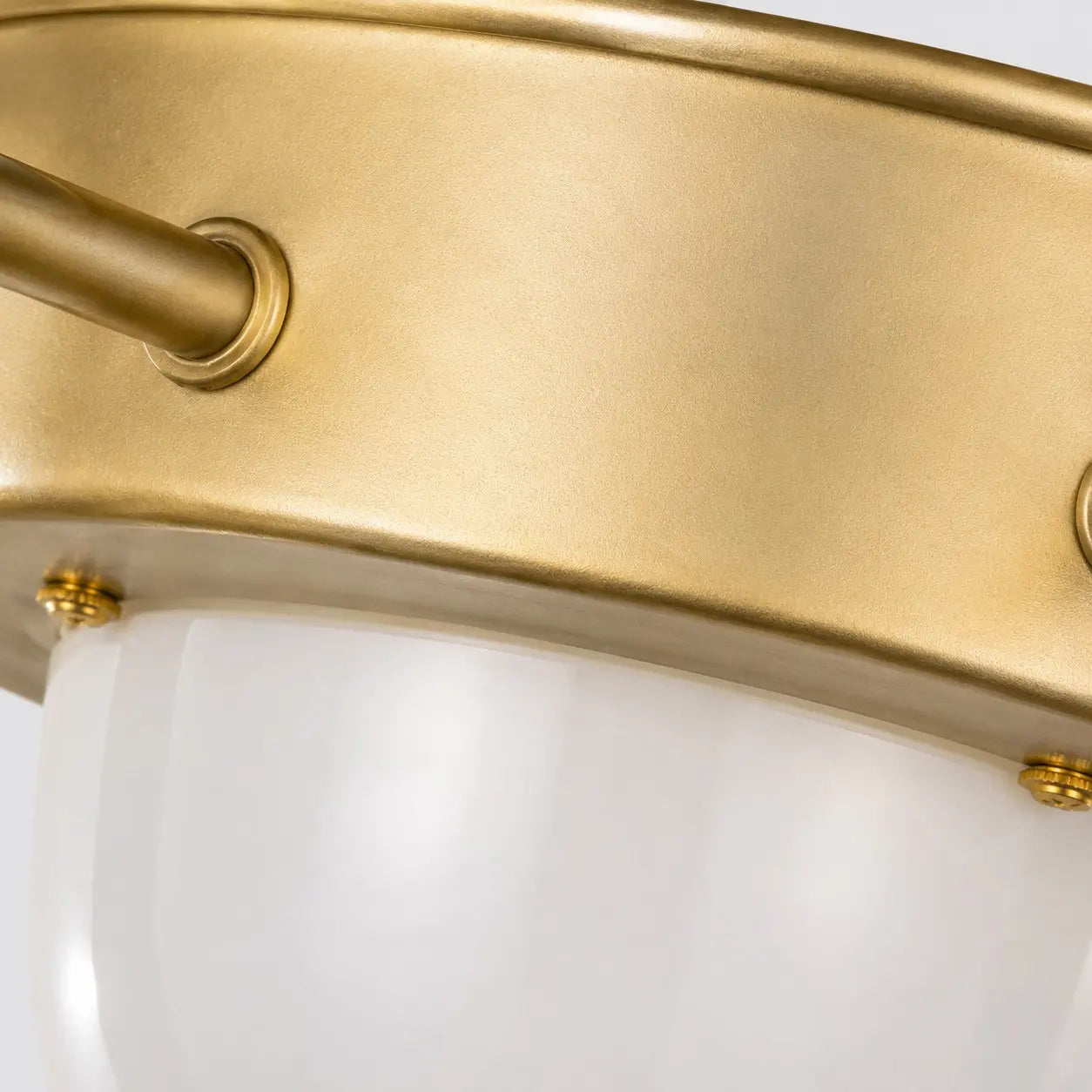 Close-up of the brushed gold iron ceiling plate