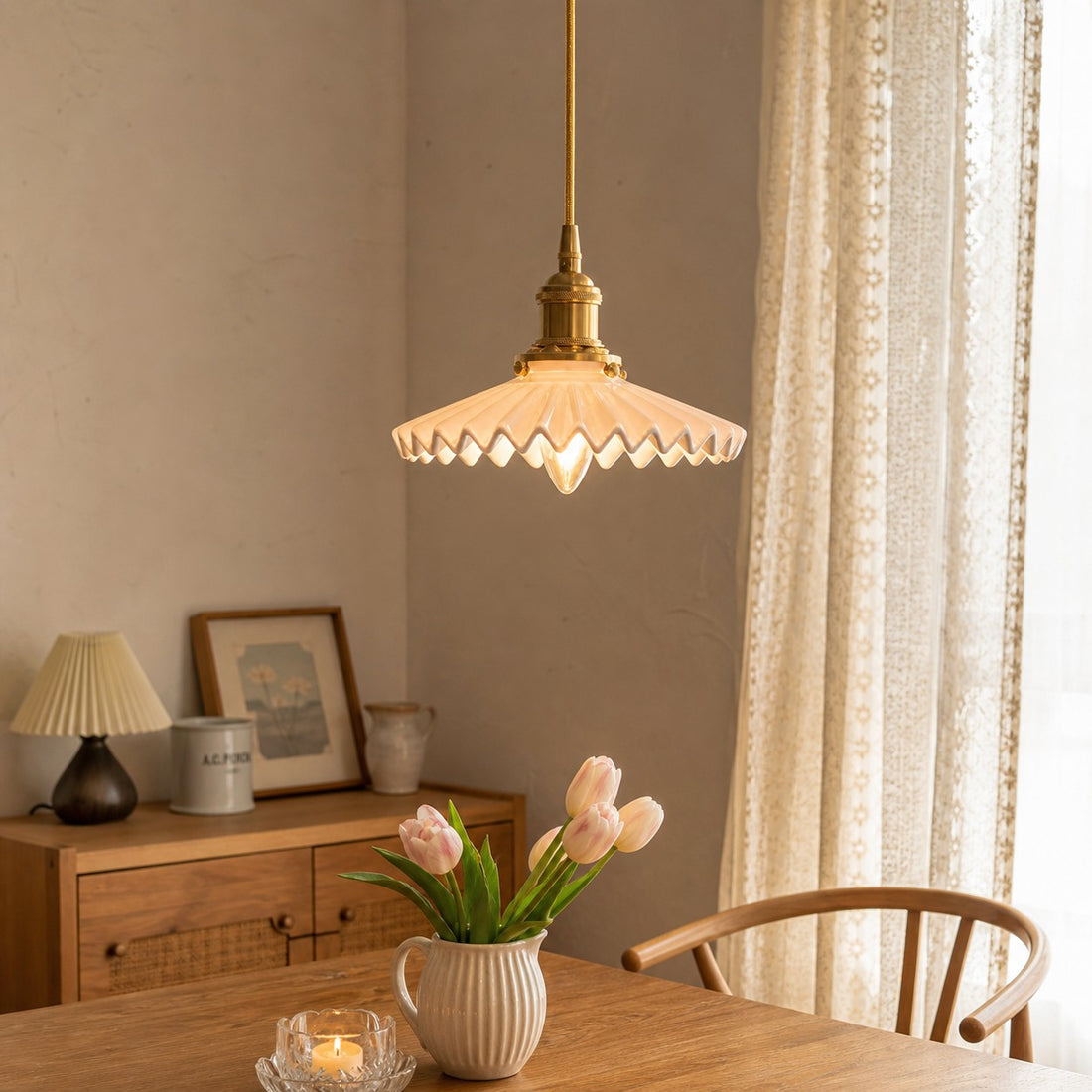 White ceramic pendant light in a warm room by a window