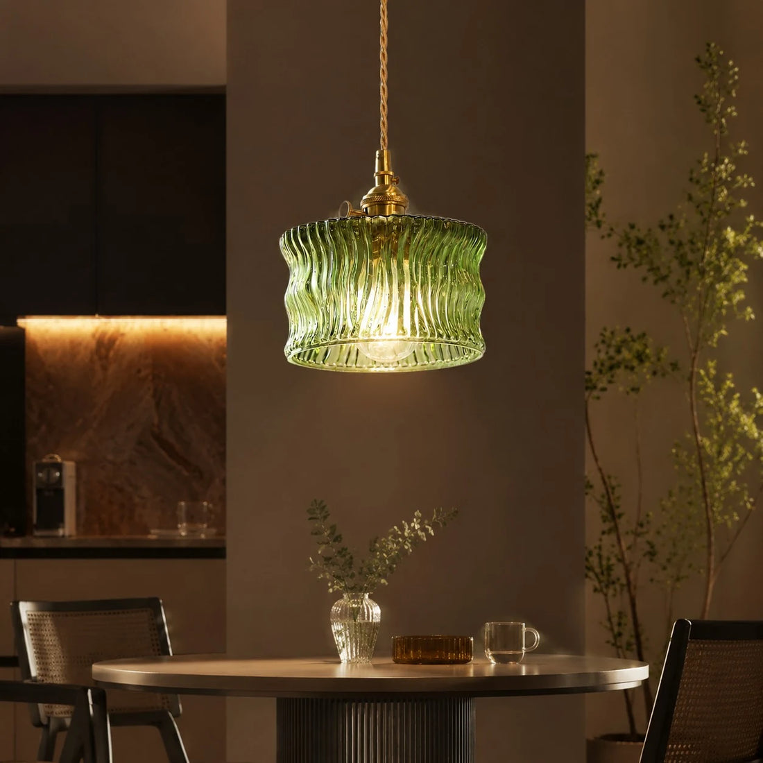 Olive green ripple glass pendant above a counter