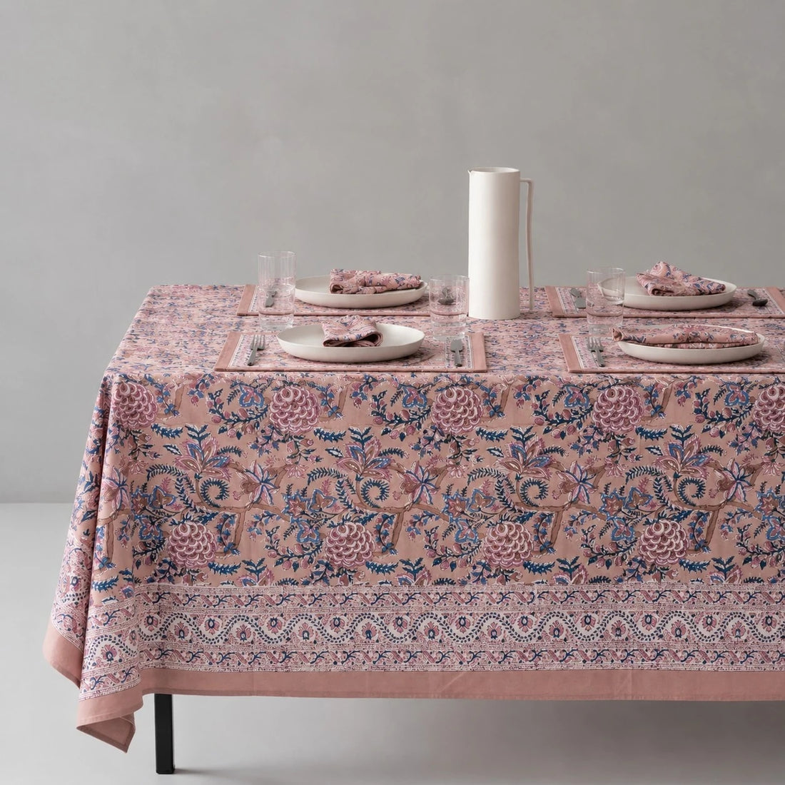 Rose mauve floral tablecloth on a dining table