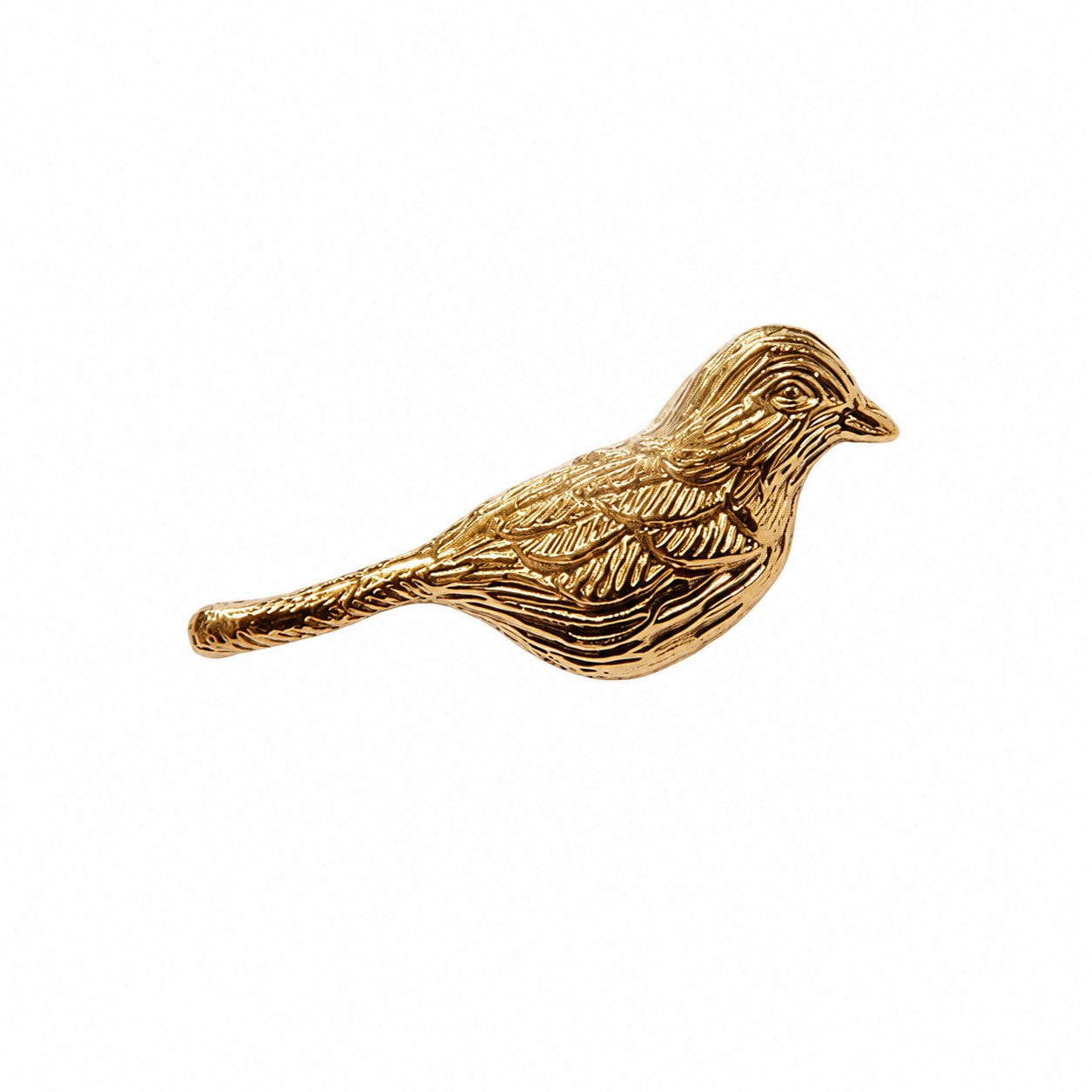 Flower and branch brass cabinet handles installed on a warm wood cabinet