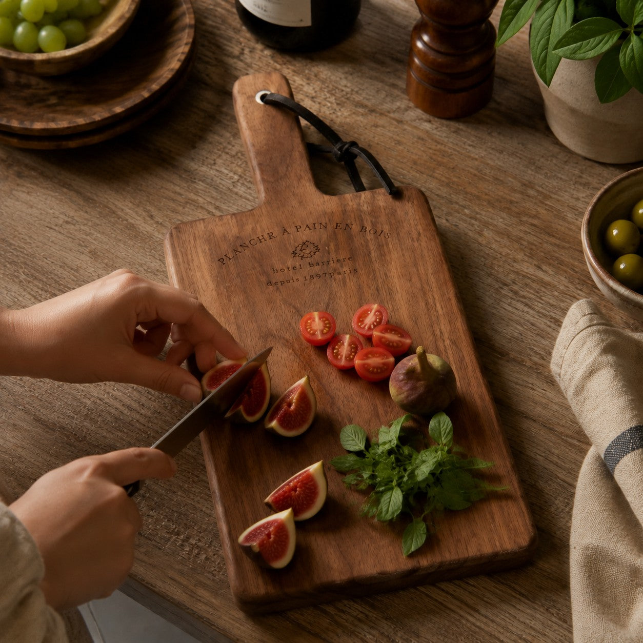 Handled wood cutting board used for fruit preparation