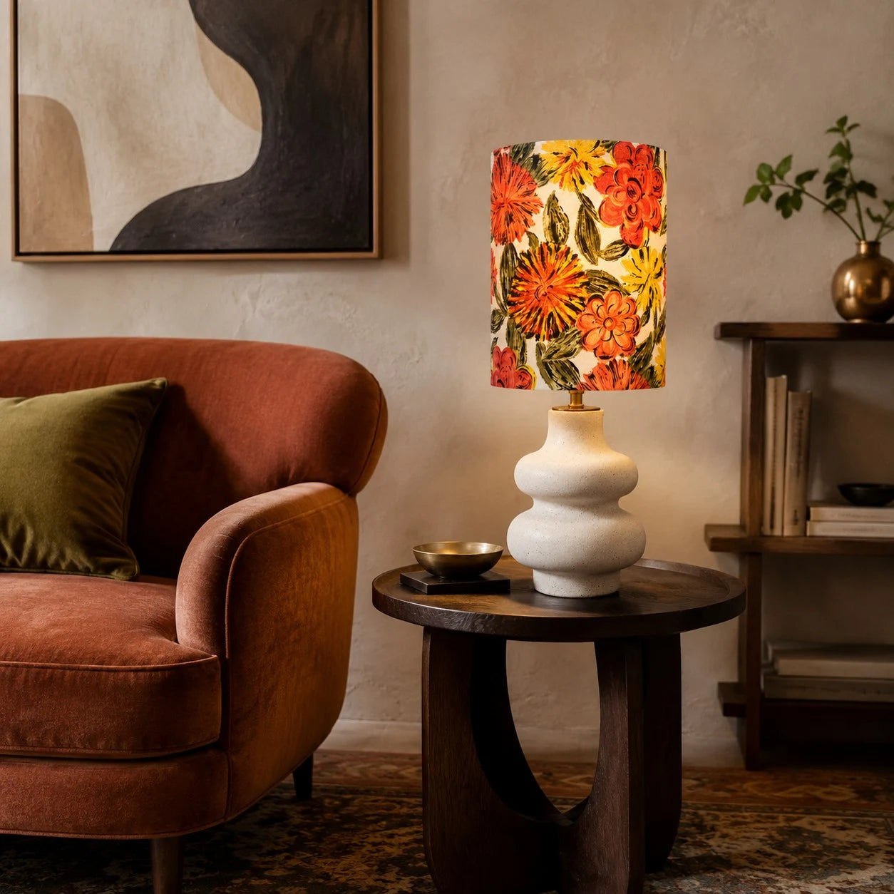 Liberty floral ceramic table lamp beside a lounge chair