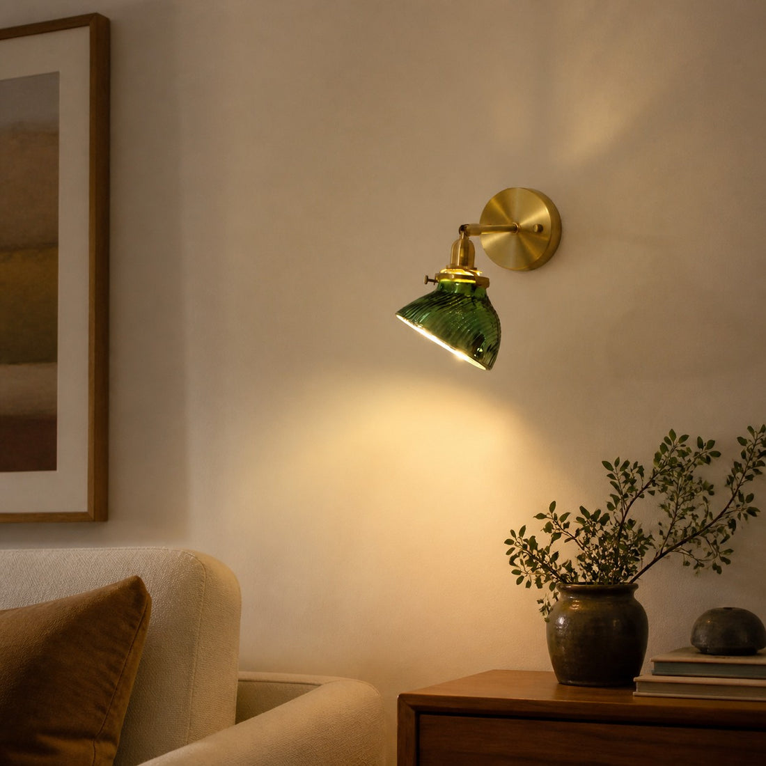 Green glass bedside wall lamp in a reading corner