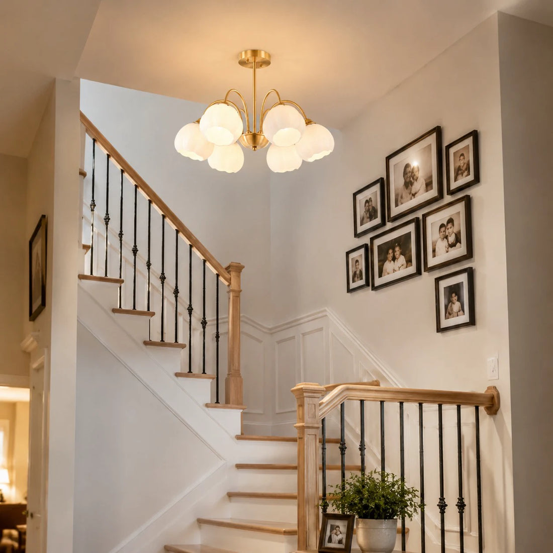 Six-arm chandelier installed above a staircase