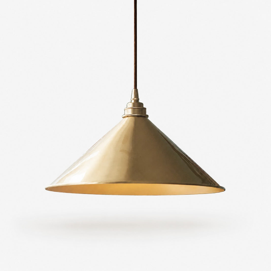 Bell shade copper pendant light on a white background