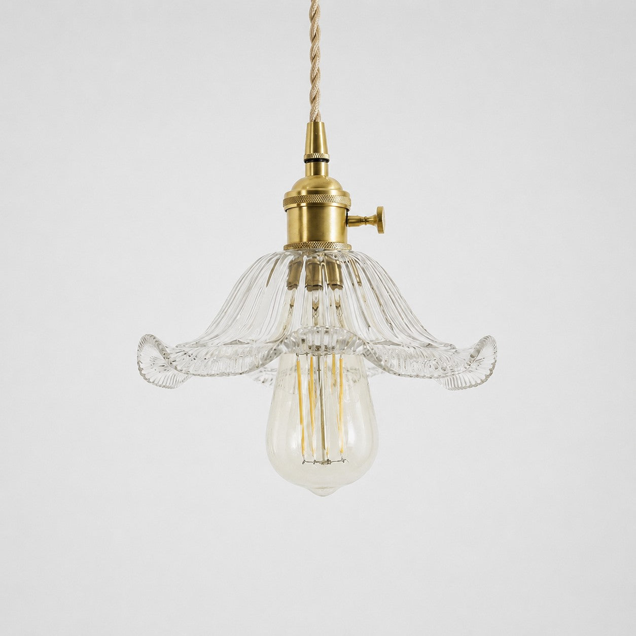 Style N textured glass shade with antique brass E27 socket, front view