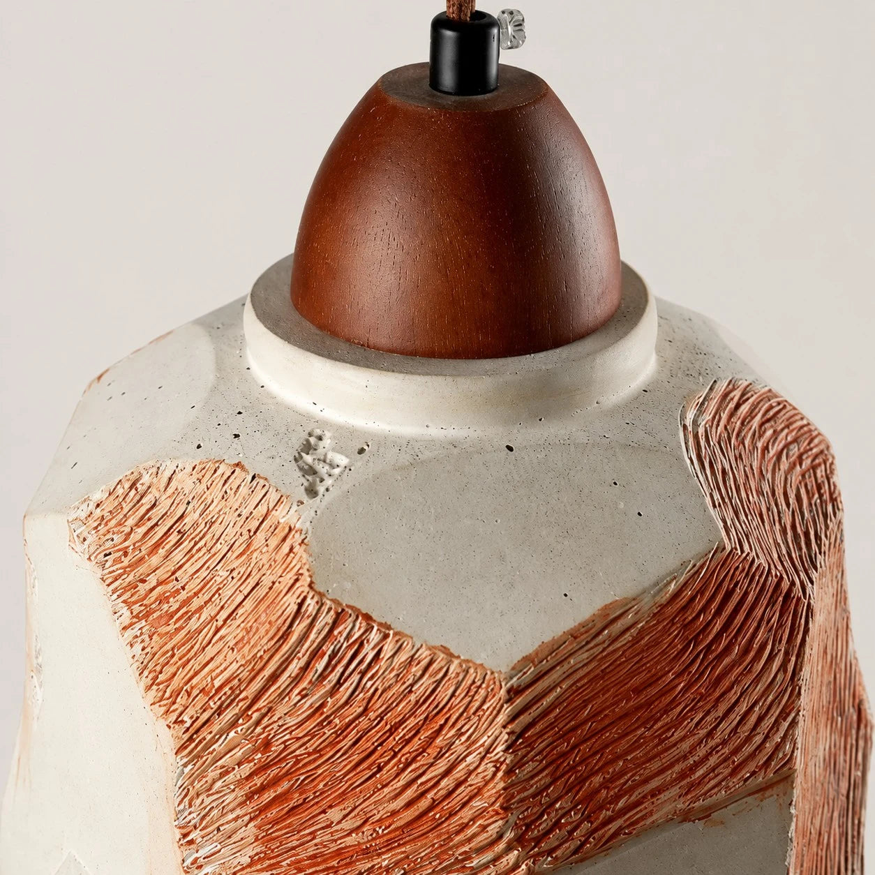 Solid wood lamp holder, cord lock, cream rim, and textured shade close-up