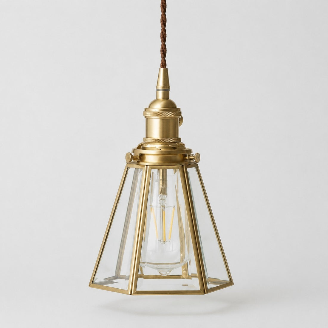 Clear glass pendant light with iron canopy