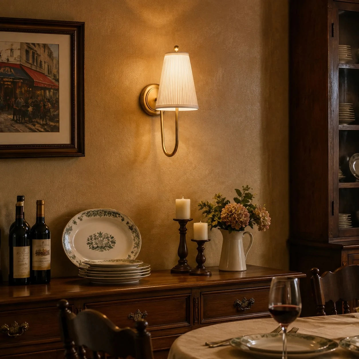 Vintage-inspired brass fabric wall sconce in a dining room